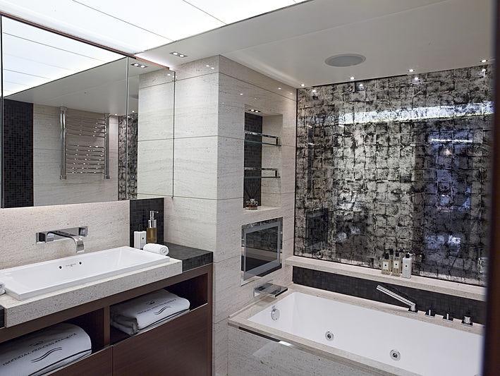 a bathroom with a large mirror aboard IMPERIAL PRINCESS BEATRICE Yacht for Charter