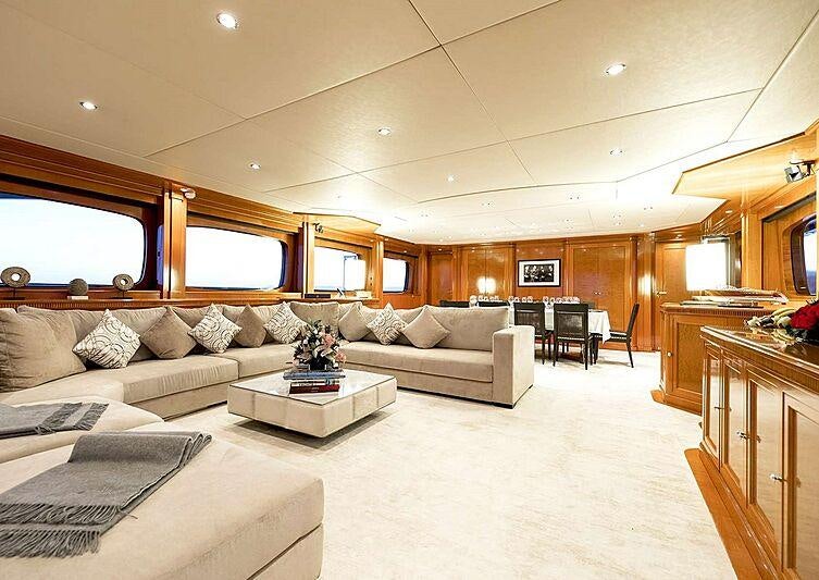 a living room with a couch and a coffee table aboard MY WAY V Yacht for Charter