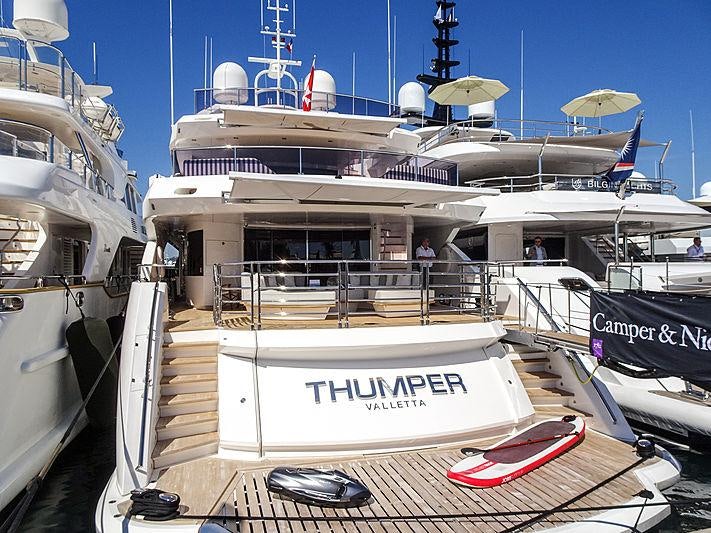 a boat docked at a pier aboard THUMPER Yacht for Charter