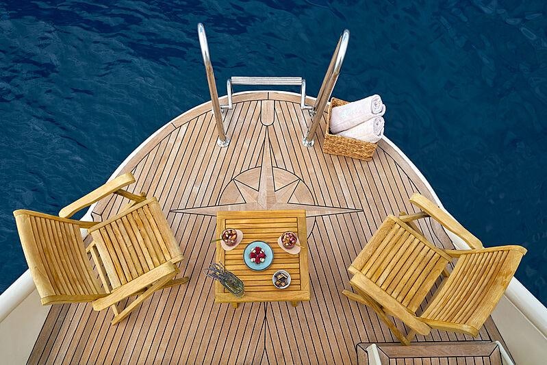 a wooden boat on a deck aboard LA PERLA Yacht for Charter