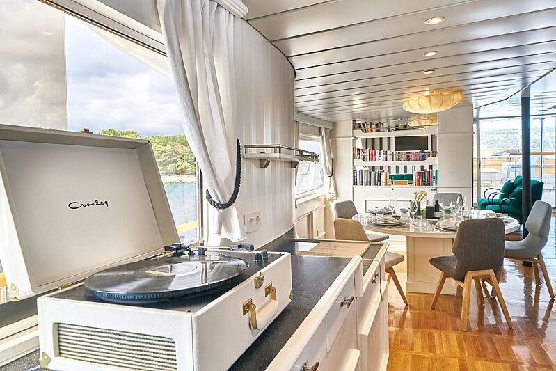 a kitchen with a large screen aboard LA PERLA Yacht for Charter