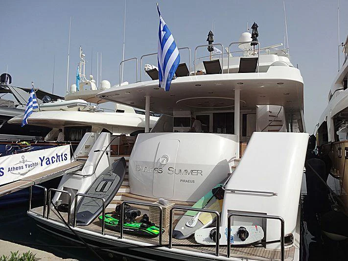 a large white boat with a flag on it aboard ENDLESS SUMMER Yacht for Charter