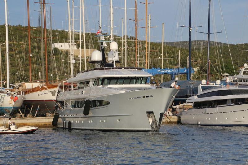 a group of boats are parked in a harbor aboard UNEXPECTED Yacht for Charter