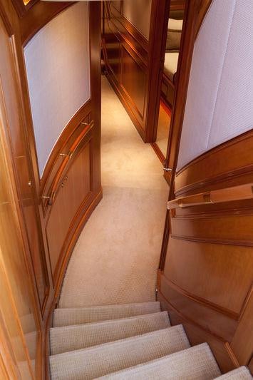 a staircase with wooden railings aboard GENEVIEVE Yacht for Charter