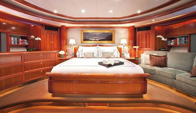 a large bed in a room aboard GENEVIEVE Yacht for Charter