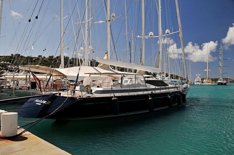 a boat docked at a pier aboard THANDEKA Yacht for Charter