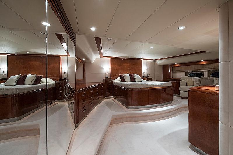 a bedroom with a bed and a couch aboard THANDEKA Yacht for Charter