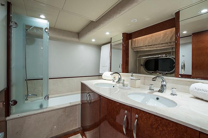a bathroom with a large mirror aboard THANDEKA Yacht for Charter