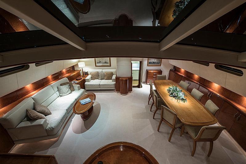 a large room with a bed and a piano aboard THANDEKA Yacht for Charter