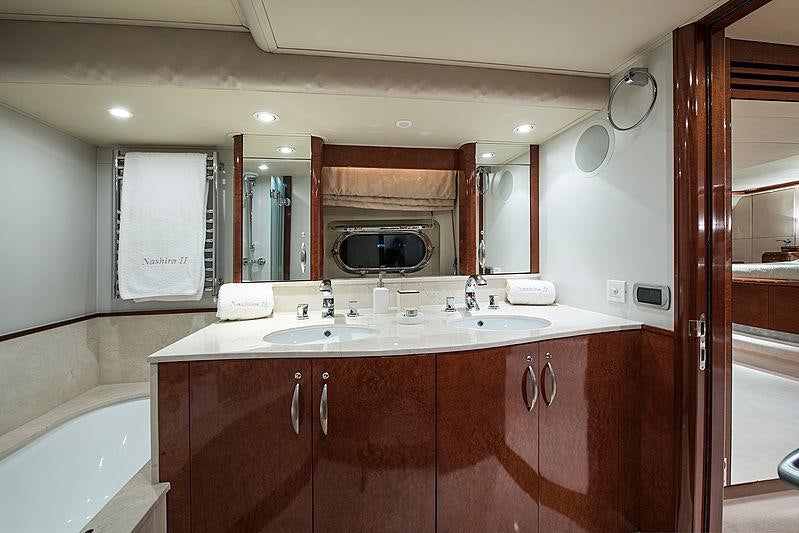 a bathroom with a large mirror aboard THANDEKA Yacht for Charter