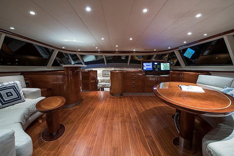 a room with a table and chairs aboard THANDEKA Yacht for Charter