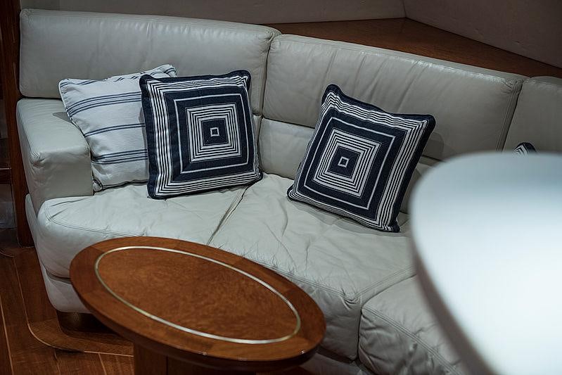 a couch with pillows and pillows aboard THANDEKA Yacht for Charter