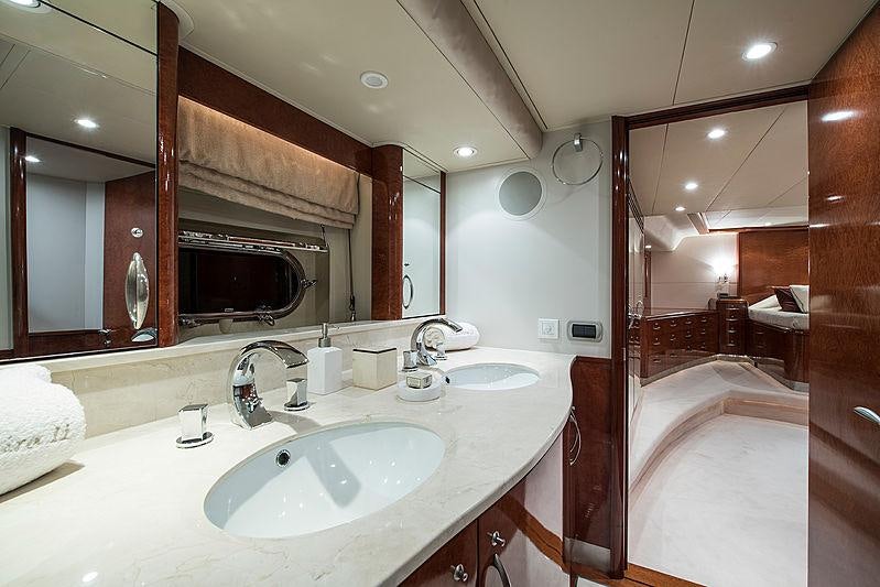 a bathroom with a large mirror aboard THANDEKA Yacht for Charter