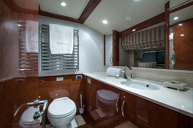 a bathroom with a toilet sink and a mirror aboard THANDEKA Yacht for Charter
