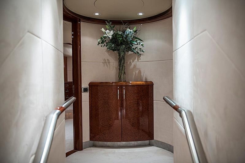 a wooden cabinet with a plant in it aboard THANDEKA Yacht for Charter
