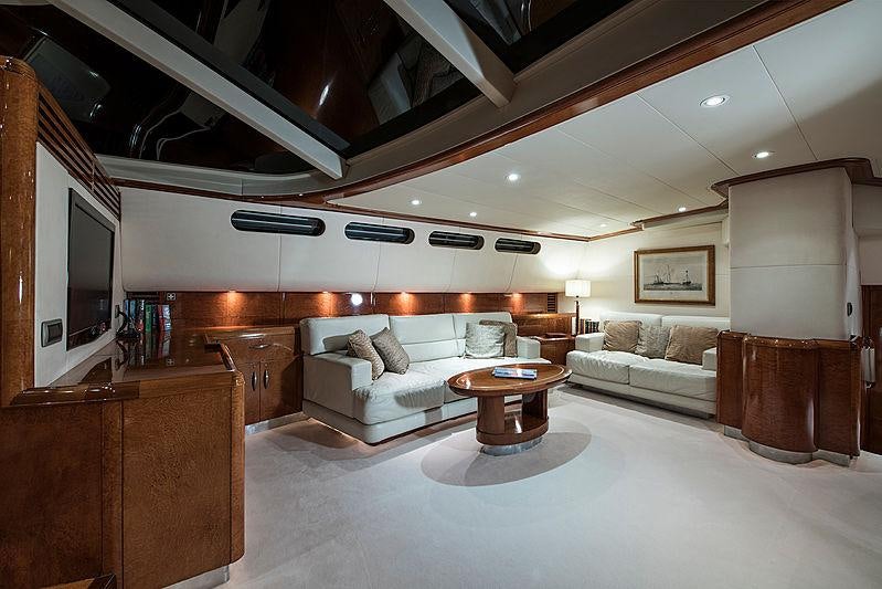 a living room with a white couch and a table aboard THANDEKA Yacht for Charter
