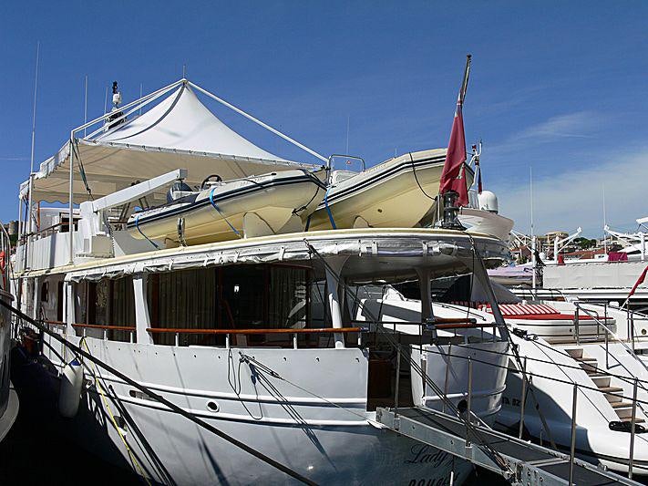 a boat with a red and white flag on it aboard LADY JERSEY Yacht for Charter