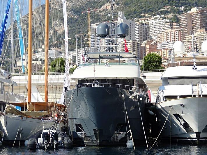 a group of boats are parked in a harbor aboard ZULU Yacht for Charter