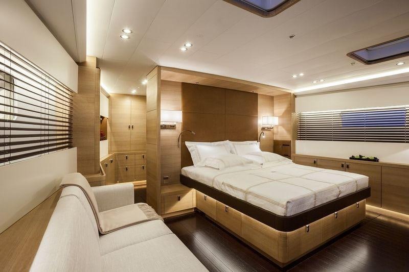 a room with a bed and a desk aboard DARLIN Yacht for Charter