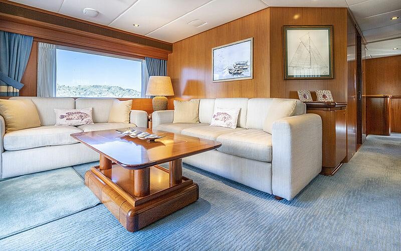 a living room with a couch and a coffee table aboard ALCOR Yacht for Charter