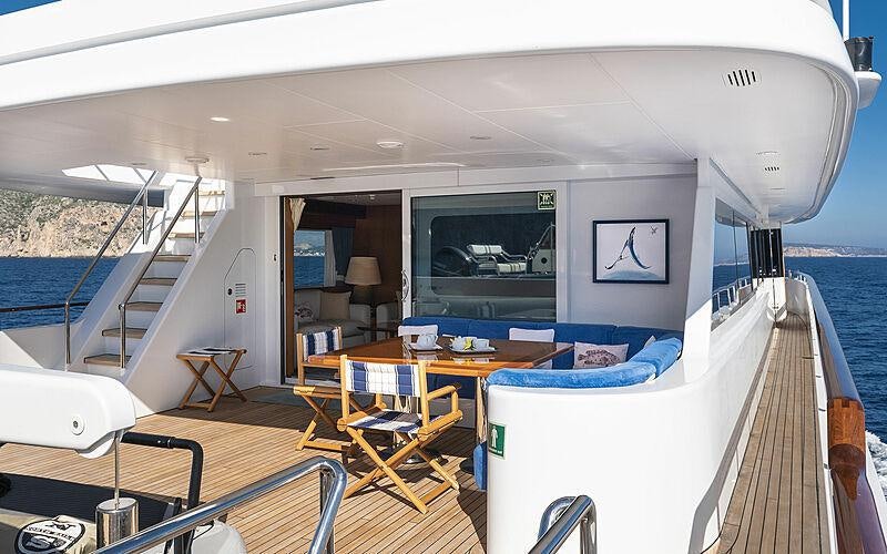 a room with a table and chairs aboard ALCOR Yacht for Charter