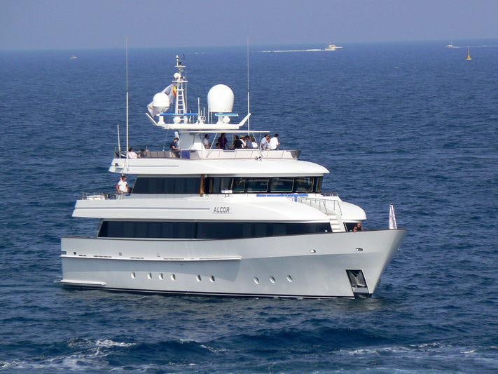 a white boat in the water aboard ALCOR Yacht for Charter