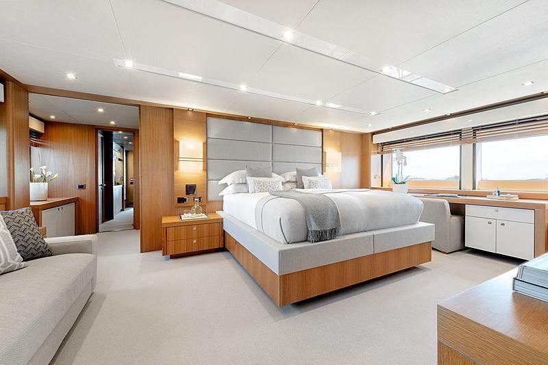 a large bedroom with a large bed aboard OKSANCHIK Yacht for Charter