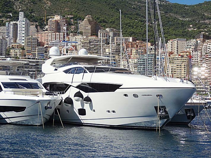 a couple of white yachts in the water aboard MAORO Yacht for Charter