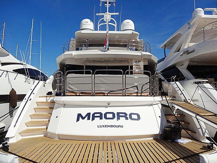 a large white boat with a blue sky aboard MAORO Yacht for Charter