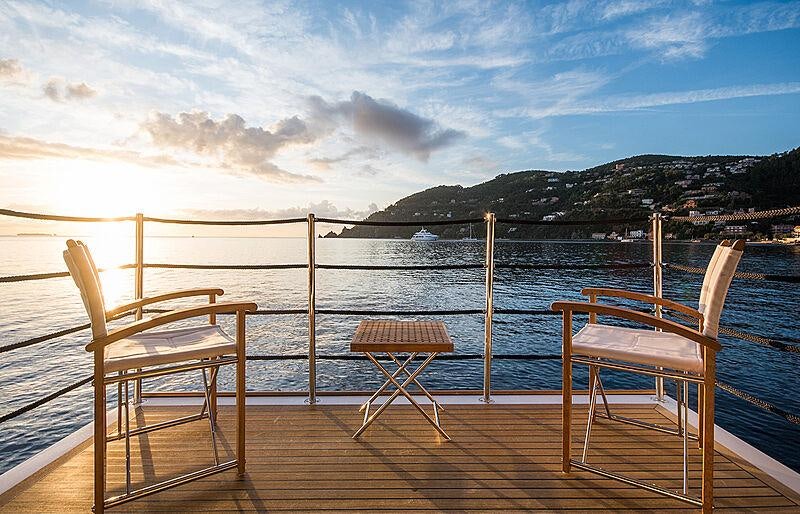 a couple of chairs on a dock aboard SOULMATE Yacht for Charter