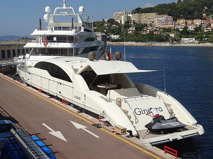 a large white boat on a dock aboard GINEVRA Yacht for Charter