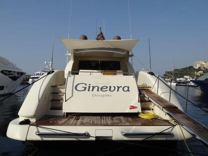 a boat parked in a harbor aboard GINEVRA Yacht for Charter
