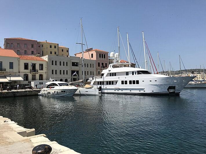 a boat docked at a pier aboard ATOM Yacht for Charter
