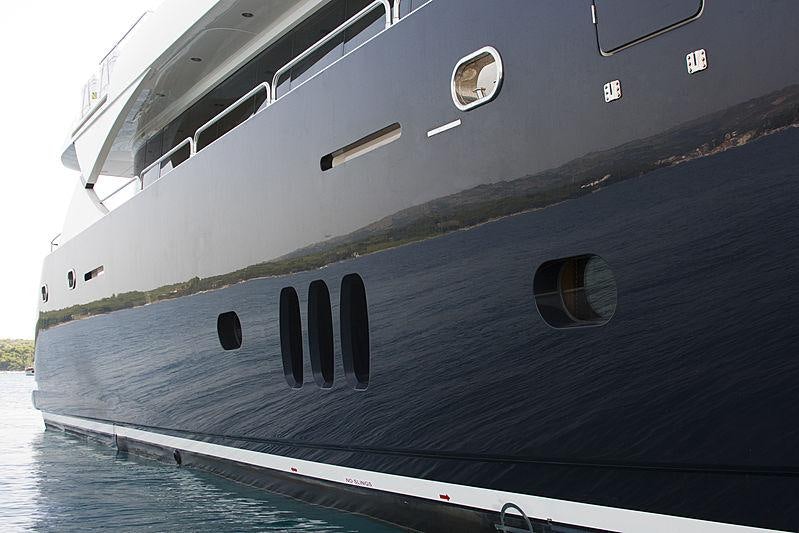 a large grey ship aboard ARAGO Yacht for Charter