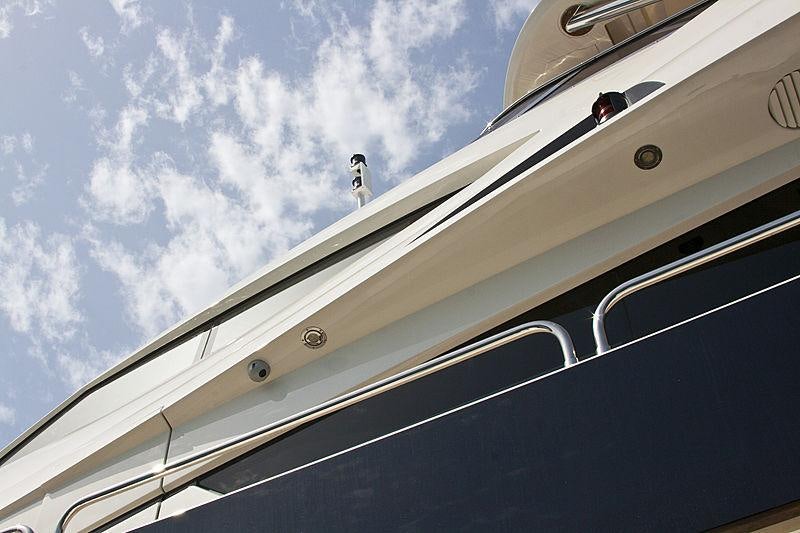 a person standing on a bridge aboard ARAGO Yacht for Charter