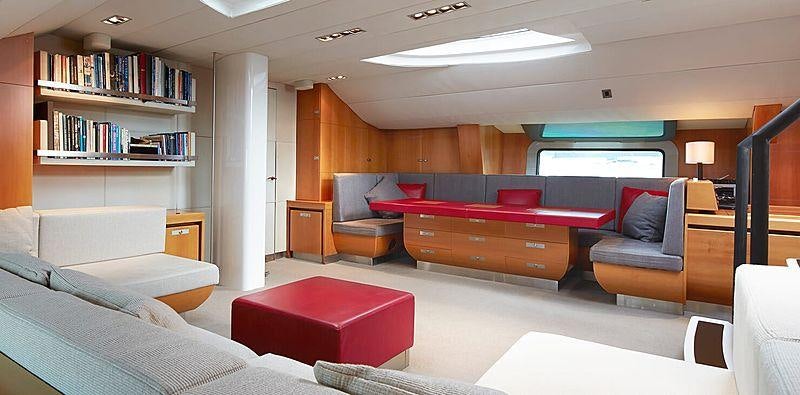a room with a bed and a couch aboard SILVERTIP Yacht for Charter