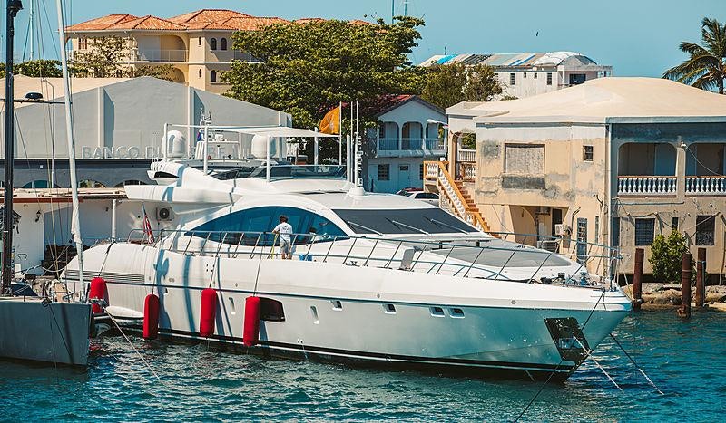 a boat docked at a pier aboard IARY Yacht for Charter