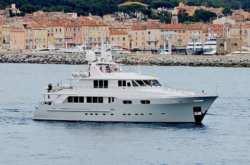 a white boat on the water aboard CHRISTINA G Yacht for Charter