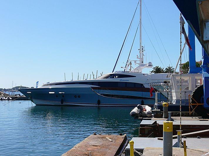 a boat docked at a pier aboard BENITA BLUE Yacht for Charter