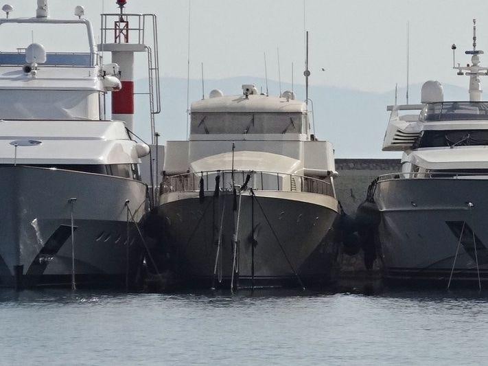 several boats docked at a pier aboard XIPHIAS Yacht for Charter