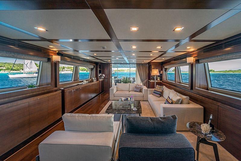 a living room with a large window aboard SEVENTH SENSE Yacht for Charter