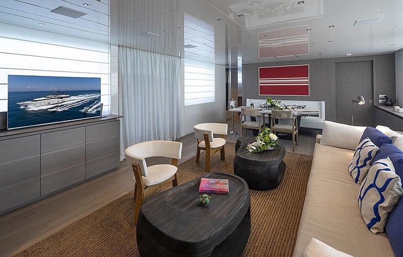 a living room with a large window aboard DINAIA Yacht for Charter