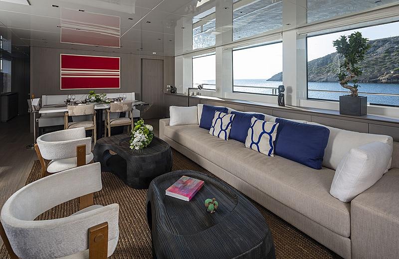 a living room with a couch and a table aboard DINAIA Yacht for Charter