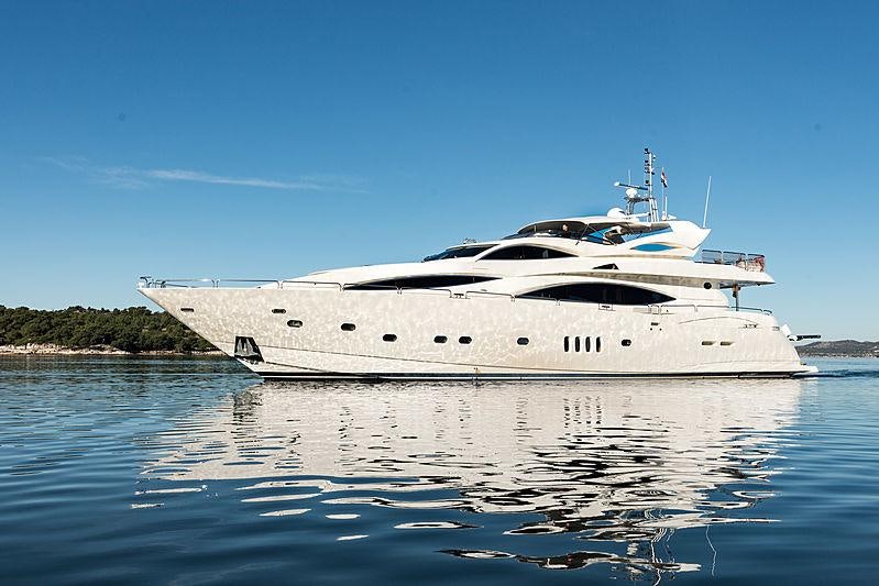 a large white boat on the water aboard BABY I Yacht for Charter