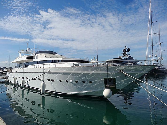 a large white boat in a harbor aboard ERA A Yacht for Charter