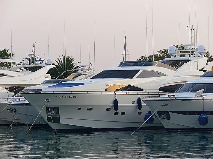 a group of boats in a harbor aboard B4 Yacht for Charter