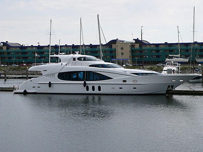 a white boat in a harbor aboard SEA BREEZE ONE Yacht for Charter