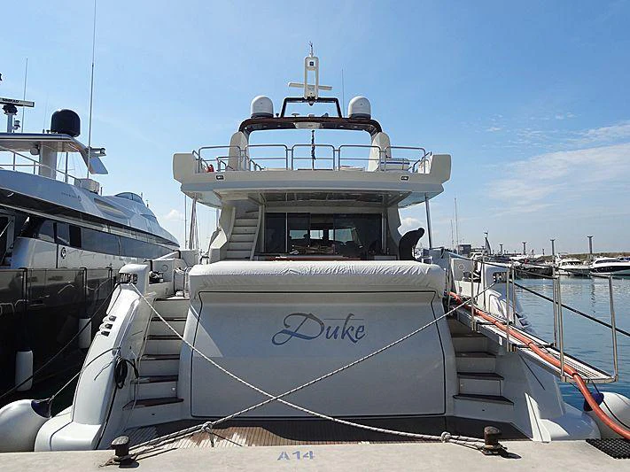 a boat docked at a pier aboard DUKE Yacht for Charter