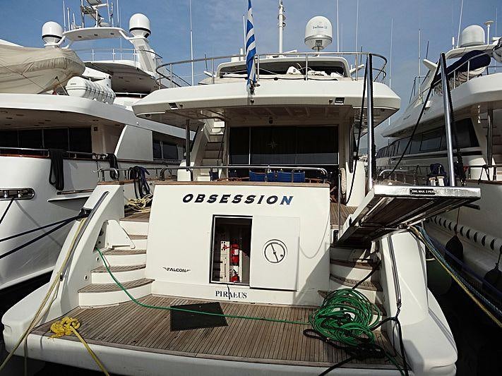 a boat with a green rope aboard OBSESSION Yacht for Charter