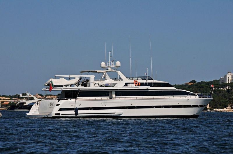 a white boat in the water aboard QUEEN SOUTH Yacht for Charter